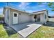 Pictured is the home's back patio, featuring a door and sliding glass door for easy access at 2420 16Th W St, Palmetto, FL 34221