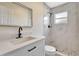 Modern bathroom featuring quartz counters, an updated shower with pebble flooring, and updated fixtures at 2420 16Th W St, Palmetto, FL 34221