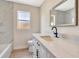 Bright bathroom featuring modern fixtures, a white vanity with quartz countertops, and a tiled shower/tub combo at 2420 16Th W St, Palmetto, FL 34221