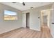 Cozy bedroom featuring light wood floors, a window providing ample natural light, and closet at 2420 16Th W St, Palmetto, FL 34221