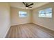 Spacious bedroom features wood-look floors, two windows, and neutral walls at 2420 16Th W St, Palmetto, FL 34221