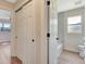 Hallway view of a full bathroom with updated tile and tub, located off of a bedroom at 2420 16Th W St, Palmetto, FL 34221