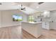 Modern kitchen features white cabinets, a central island, and sleek countertops at 2420 16Th W St, Palmetto, FL 34221