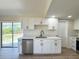 Bright kitchen featuring stainless steel dishwasher, white cabinetry and lots of natural light at 2420 16Th W St, Palmetto, FL 34221