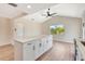 Bright, modern kitchen features white cabinets, a central island, and contemporary design at 2420 16Th W St, Palmetto, FL 34221