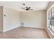 Bright living space with modern flooring, neutral walls, a ceiling fan, and a large window at 2420 16Th W St, Palmetto, FL 34221