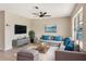 Cozy living room with a plush sectional, stylish furnishings, and a mounted TV for relaxation at 2420 16Th W St, Palmetto, FL 34221
