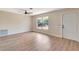 Bright living room featuring modern flooring, ample natural light, and a ceiling fan at 2420 16Th W St, Palmetto, FL 34221
