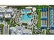 Overhead of the community amenities, including a lagoon-style pool, lap pool, and tennis courts at 26000 Seastone Dr, Englewood, FL 34223