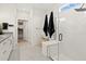 Elegant bathroom with glass shower, double vanity, and access to walk-in closet at 26000 Seastone Dr, Englewood, FL 34223