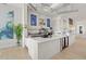 Contemporary clubhouse featuring a cafe and sleek counter with beverage displays at 26000 Seastone Dr, Englewood, FL 34223