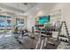 Bright gym with weights, equipment, motivational signage, and scenic outdoor views through expansive windows at 26000 Seastone Dr, Englewood, FL 34223