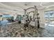 State-of-the-art fitness center featuring modern exercise equipment and ample natural light for a healthy lifestyle at 26000 Seastone Dr, Englewood, FL 34223