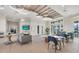 Bright lounge area with modern decor, featuring a comfortable seating area, television, and contemporary lighting fixtures at 26000 Seastone Dr, Englewood, FL 34223