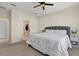 Primary bedroom featuring a bed, bedside tables, and an ensuite bathroom at 26000 Seastone Dr, Englewood, FL 34223