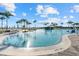 Resort-style pool surrounded by lush landscaping and comfortable seating, perfect for relaxation and recreation at 26000 Seastone Dr, Englewood, FL 34223