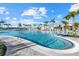 Large, inviting pool with a wading area, framed by palm trees and a well-appointed clubhouse at 26000 Seastone Dr, Englewood, FL 34223