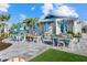 Outdoor dining area with comfortable seating, lush landscaping, and casual dining at the Bar & Grill at 26000 Seastone Dr, Englewood, FL 34223