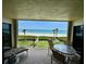 Spacious outdoor balcony with comfortable seating and beach views at 2675 Gulf Of Mexico Dr # 203, Longboat Key, FL 34228