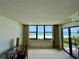 Bright, carpeted, bedroom with a beach view at 2675 Gulf Of Mexico Dr # 203, Longboat Key, FL 34228
