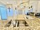Kitchen featuring granite countertops and views of the adacent living spaces at 2675 Gulf Of Mexico Dr # 203, Longboat Key, FL 34228