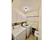Laundry room with washer, dryer, storage cabinets and shelving at 2675 Gulf Of Mexico Dr # 203, Longboat Key, FL 34228