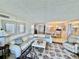 Spacious living room with a cozy sitting area and ocean views at 2675 Gulf Of Mexico Dr # 203, Longboat Key, FL 34228