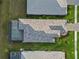 An aerial view of roof and backyard with a screened-in pool at 2794 Butterfly Jasmine Trl, Sarasota, FL 34240