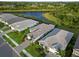Aerial view of community and homes, highlighting proximity to lake at 2794 Butterfly Jasmine Trl, Sarasota, FL 34240