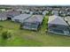 Aerial backyard view showing screen enclosed spa and pool area at 2794 Butterfly Jasmine Trl, Sarasota, FL 34240