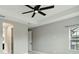 Bedroom with tile floors, ceiling fan, and ample natural light at 2794 Butterfly Jasmine Trl, Sarasota, FL 34240