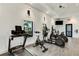 Bright and airy fitness center equipped with modern cardio machines and natural light at 2794 Butterfly Jasmine Trl, Sarasota, FL 34240