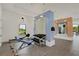 Bright gym featuring modern exercise equipment, weights, and mirrors at 2794 Butterfly Jasmine Trl, Sarasota, FL 34240