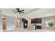 Open-concept kitchen with dark blue cabinets, white marble floors, and stainless-steel appliances, great for entertaining at 2794 Butterfly Jasmine Trl, Sarasota, FL 34240