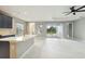 Bright and airy living room with marble floors, neutral walls, and sliding glass doors leading to the lanai at 2794 Butterfly Jasmine Trl, Sarasota, FL 34240