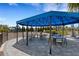 Outdoor picnic area featuring shaded tables and nearby playground equipment at 2794 Butterfly Jasmine Trl, Sarasota, FL 34240