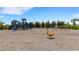 Community playground featuring swings, slides, and various play structures for children at 2794 Butterfly Jasmine Trl, Sarasota, FL 34240