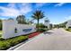 Windward Lakewood Ranch entrance sign with beautiful landscaping and a guard house at 2794 Butterfly Jasmine Trl, Sarasota, FL 34240