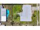 Aerial view of the property showcasing the house, the backyard, and the surrounding neighborhood at 2801 21St W Ave, Bradenton, FL 34205