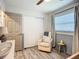 Well-lit Bedroom featuring a glider chair, window, ceiling fan, and closet at 2801 21St W Ave, Bradenton, FL 34205