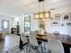 Inviting dining room showcasing a wood table, unique light fixture, and stylish decor at 2801 21St W Ave, Bradenton, FL 34205