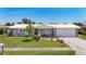 Charming home with well-maintained lawn, beautiful landscaping, and a welcoming front porch at 2801 21St W Ave, Bradenton, FL 34205