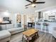Spacious living room with sleek wood floors, an open layout, and stylish furnishings, ideal for modern living at 2801 21St W Ave, Bradenton, FL 34205