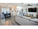 Bright open-concept living space with wood floors and a view of the dining and kitchen areas at 2801 21St W Ave, Bradenton, FL 34205