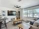 Bright living room featuring a large window, comfortable seating, and modern decor for a relaxing atmosphere at 2801 21St W Ave, Bradenton, FL 34205