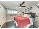 Cozy bedroom with dark floors, ceiling fan, unique decor, and a comfortable bed with plush bedding at 33 S Gulfstream Ave # 306, Sarasota, FL 34236