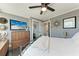 Comfortable bedroom with gray walls, mounted television, ceiling fan, and access to the ensuite at 33 S Gulfstream Ave # 306, Sarasota, FL 34236
