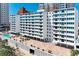 Beautiful exterior showcasing the building's architecture, landscaping, and pool area at 33 S Gulfstream Ave # 306, Sarasota, FL 34236