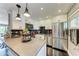 Updated kitchen with stainless steel appliances, black backsplash, and gray countertop at 33 S Gulfstream Ave # 306, Sarasota, FL 34236