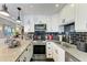 Modern kitchen boasts stainless appliances, black tile backsplash, and ample counter space at 33 S Gulfstream Ave # 306, Sarasota, FL 34236